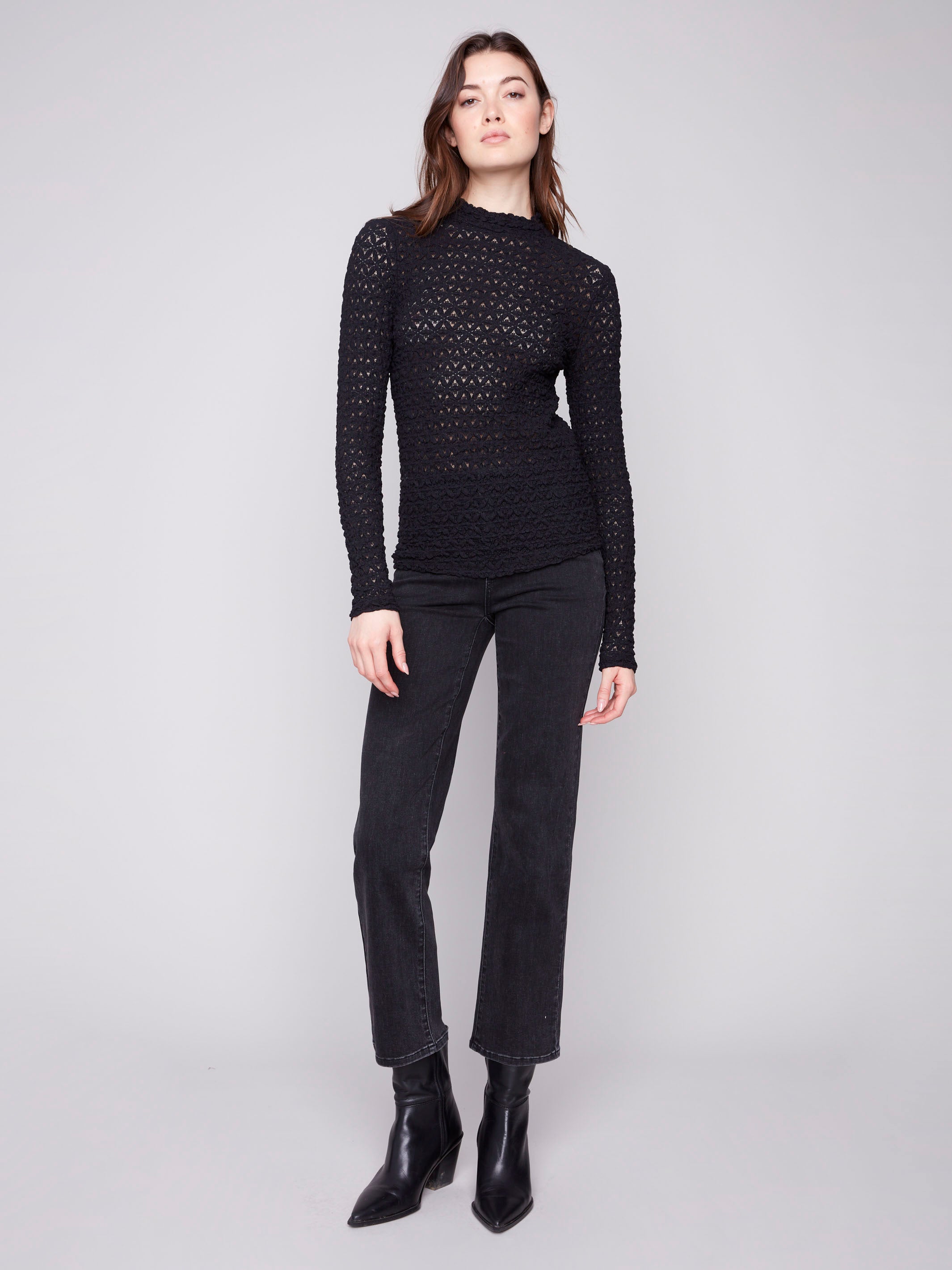Chic black lace top with a mock neck design and semi-sheer finish, ideal for layering by Charlie B.