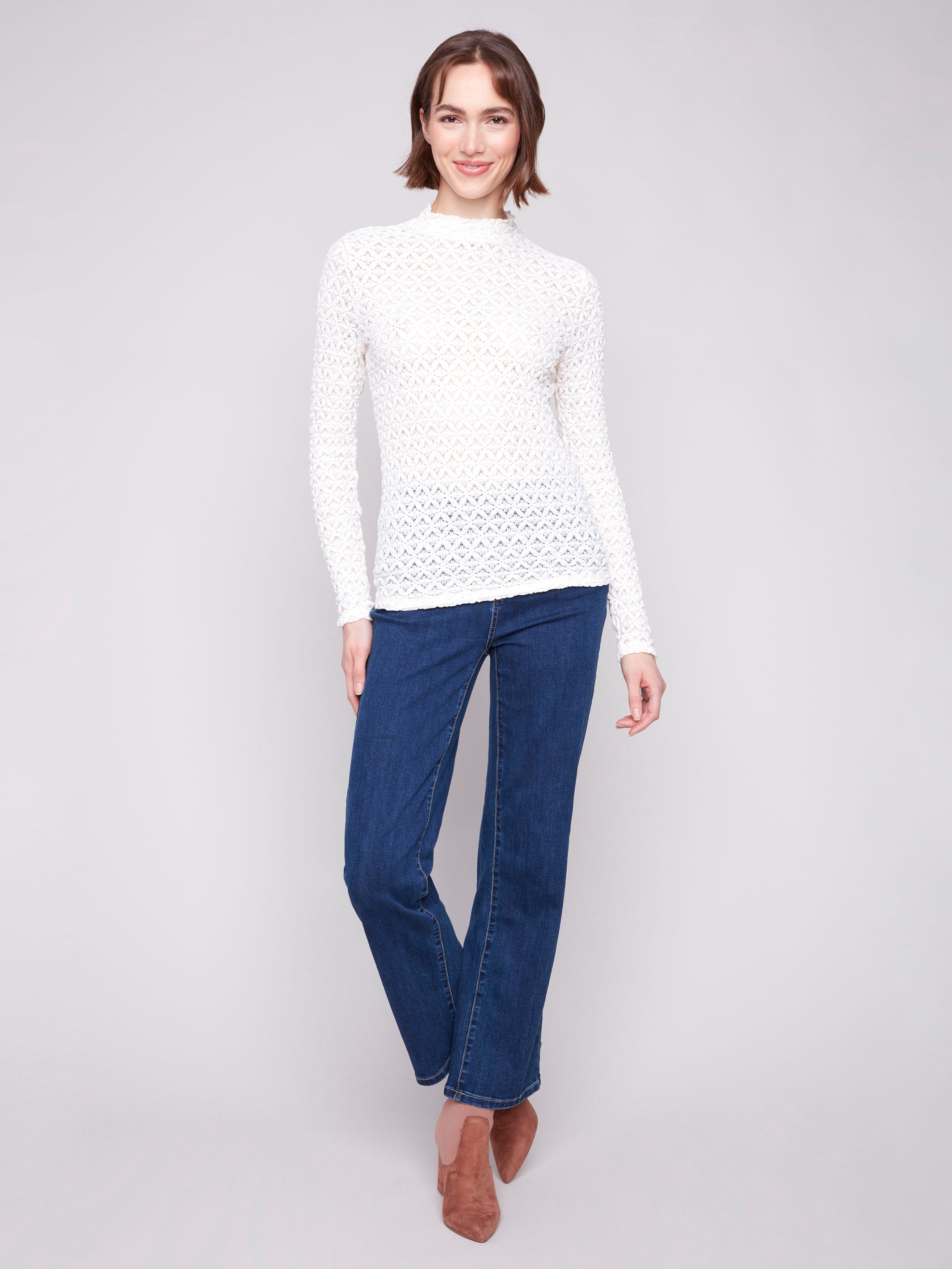 Chic ecru lace top with a semi-sheer design, adding elegance to any outfit by Charlie B.