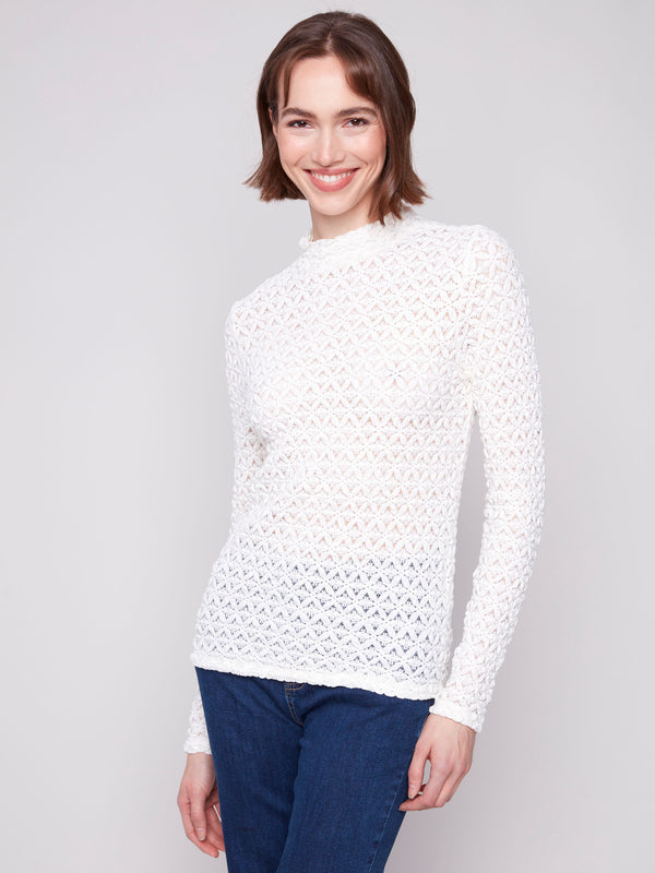 Intricate lace pattern on this ecru top offers both style and sophistication by Charlie B.