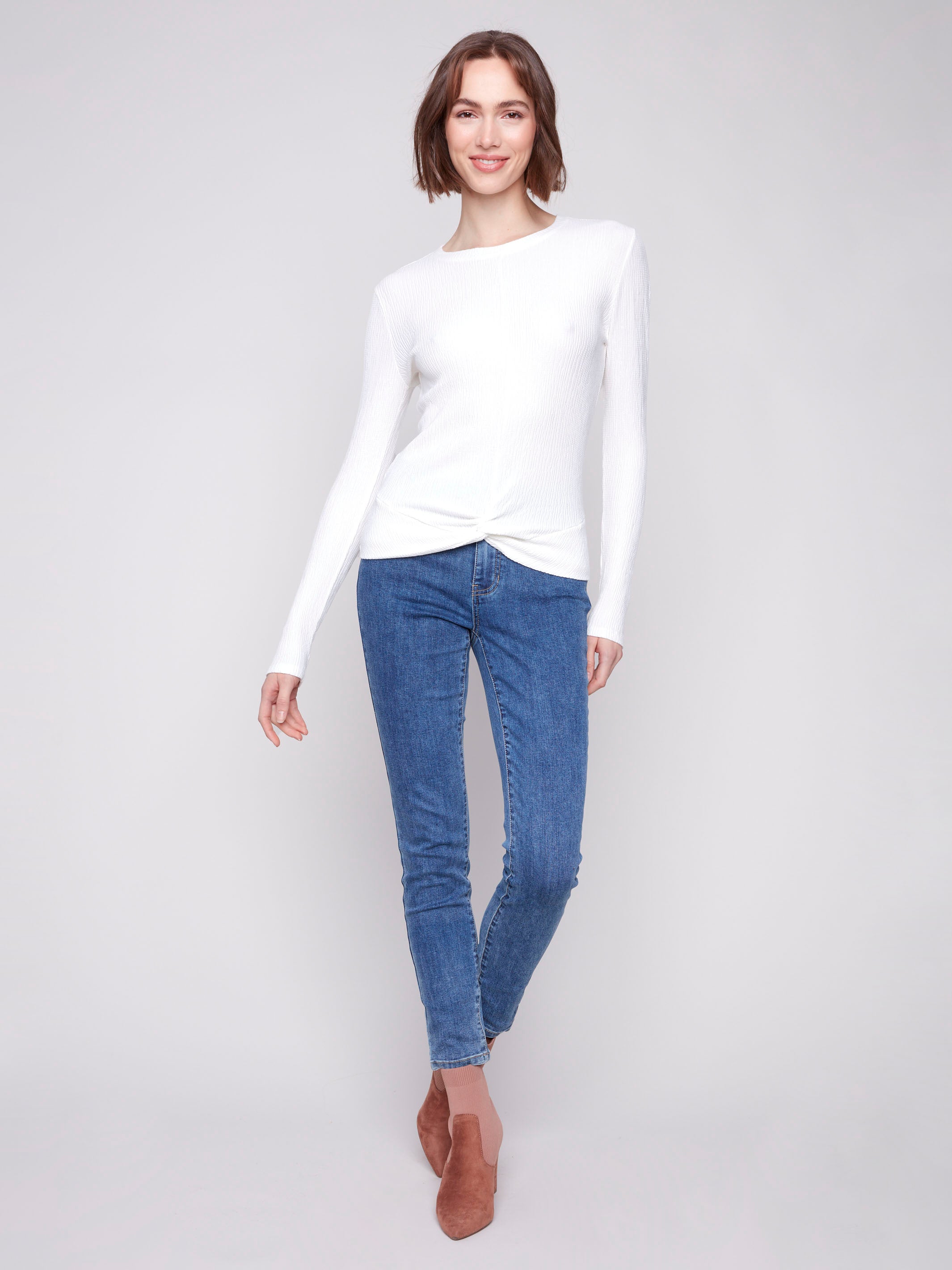 Ecru long sleeve textured knit top with a front knot by Charlie B.