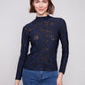 Elegant blue black top featuring a slim fit and intricate burnout pattern for a chic look by Charlie B.