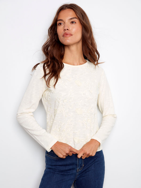 Ecru jersey top with floral embroidery detailing, crafted from 100% cotton for a soft touch by Charlie B.