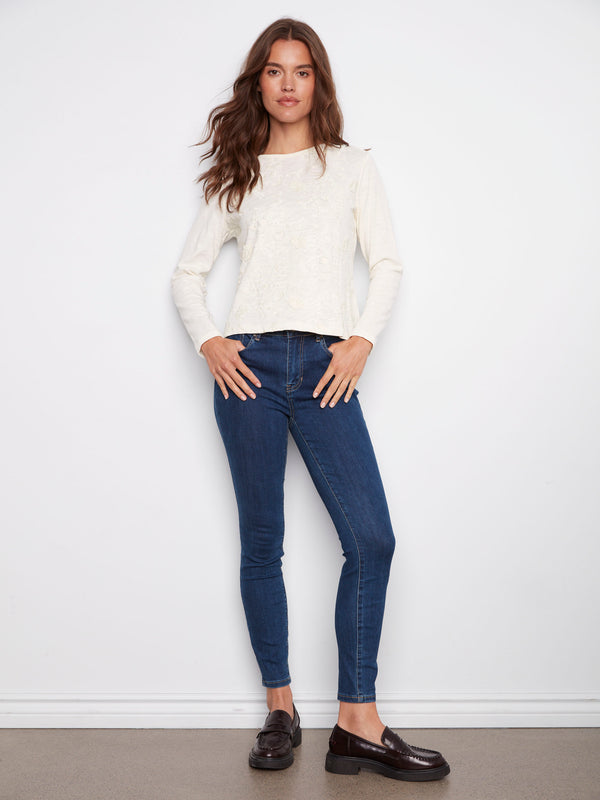 Chic ecru top featuring long sleeves and delicate floral patterns, designed in pure cotton by Charlie B.