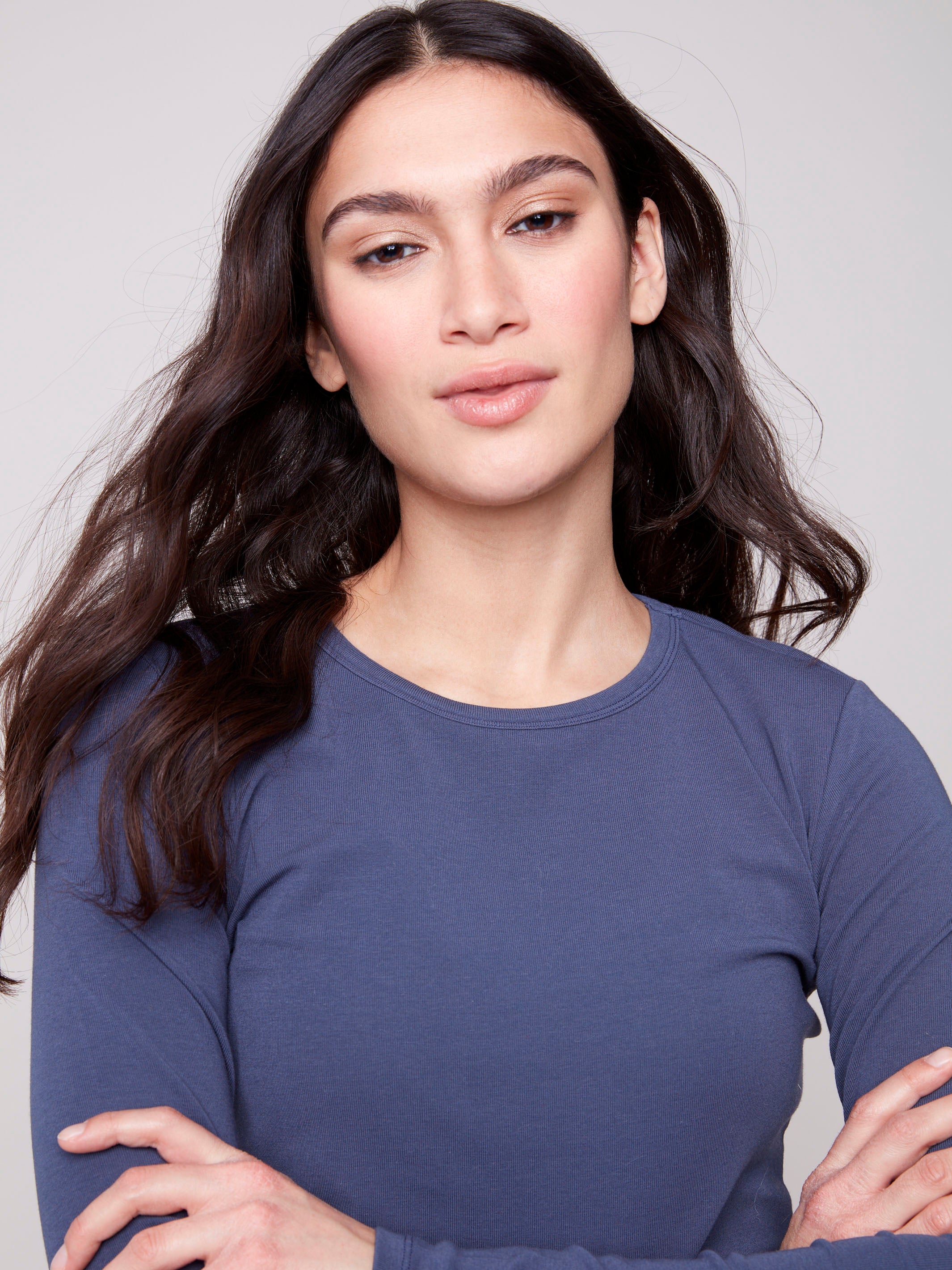 Crew neck design on this knit top provides classic appeal for any wardrobe by Charlie B.