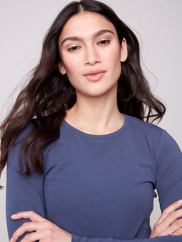 Crew neck design on this knit top provides classic appeal for any wardrobe by Charlie B.