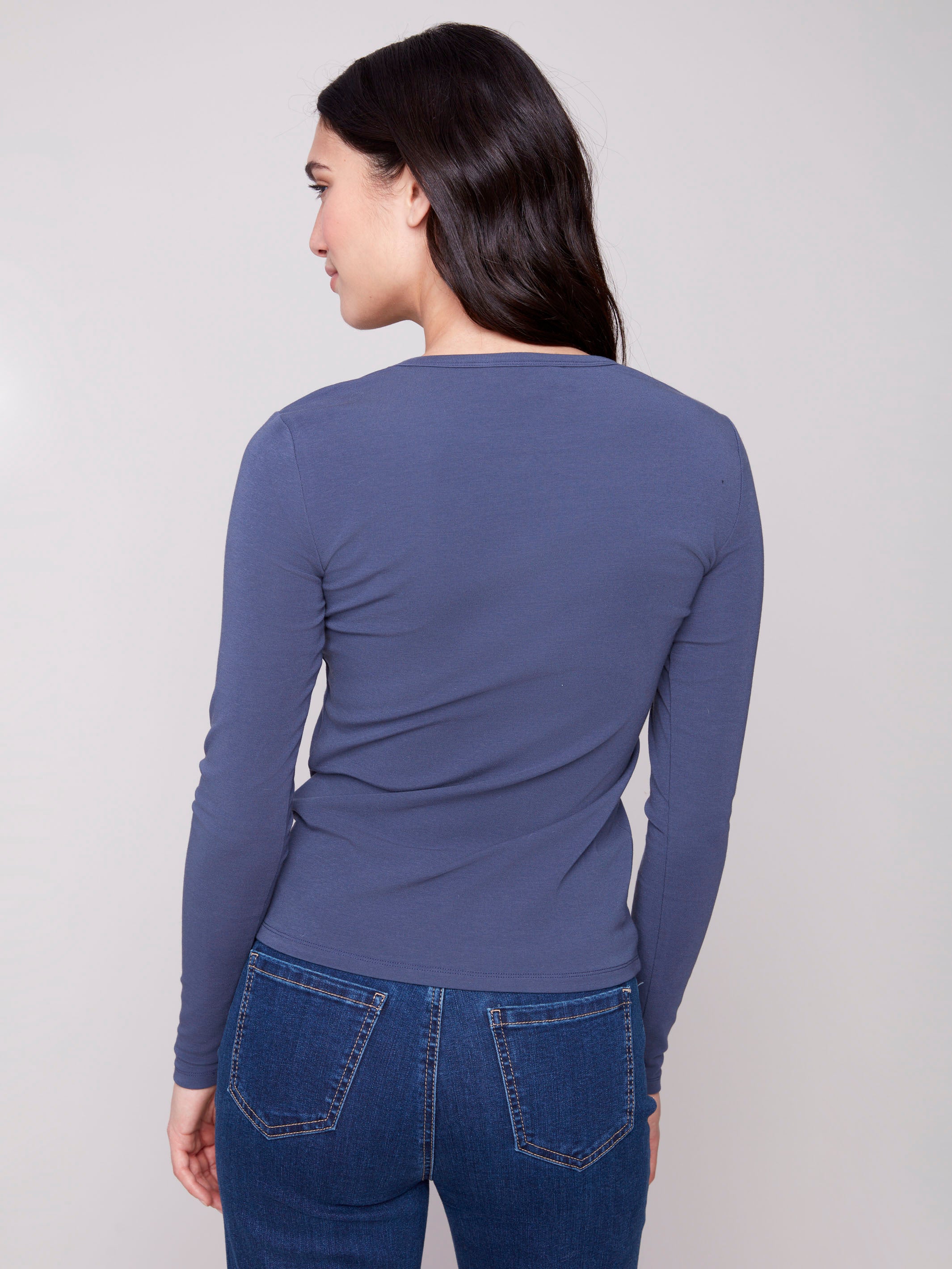 Slim fit denim knit top crafted from quality cotton blend material by Charlie B.