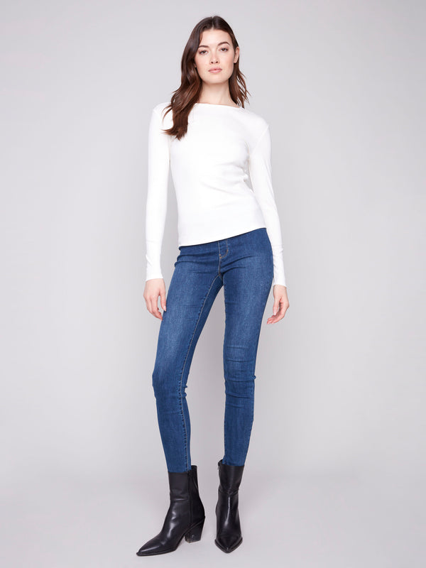 Stylish ecru top with a classic crew neckline, ideal for layering or wearing alone by Charlie B.