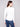 Ecru knit top designed with long sleeves for added warmth and style in cooler weather by Charlie B.