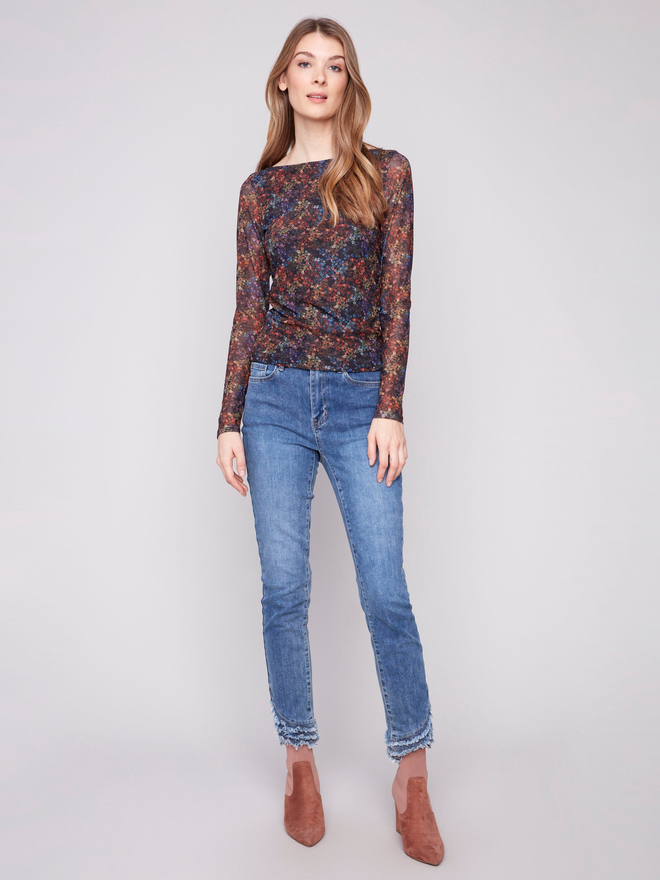 Elegant floret printed mesh top with long sleeves and ruching at the sides, ideal for stylish comfort by Charlie B.