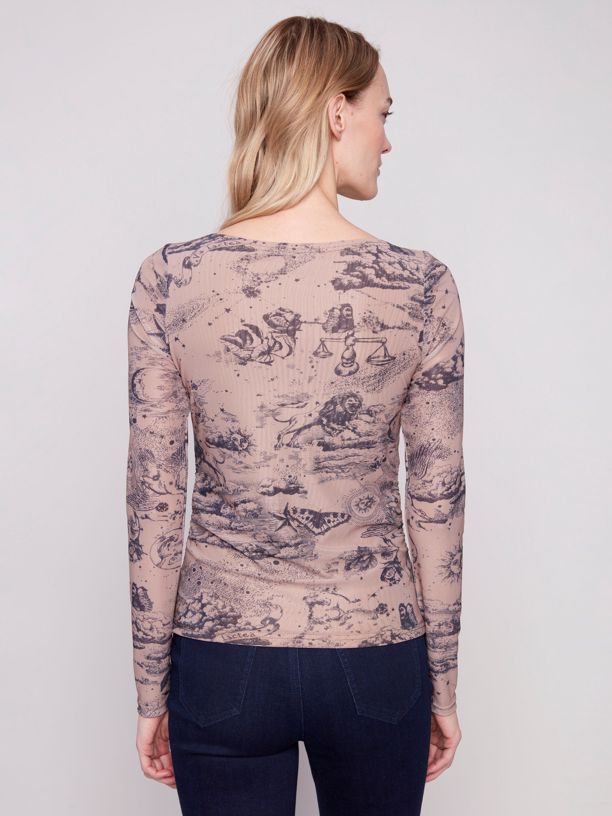 Chic mesh top showcasing long sleeves with an astrology theme, perfectly styled for any occasion by Charlie B.