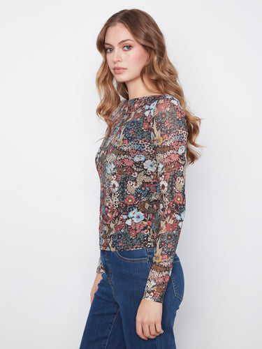 Stylish top featuring a captivating floral pattern and comfortable body lining by Charlie B.