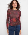 This top features a boat neckline, adding elegance to its floral pattern design. Perfect for any occasion. By Charlie B.