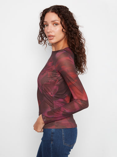 The body-lined design of this top offers a flattering silhouette, enhancing the floral pattern beautifully. By Charlie B.