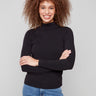 Black top with slim fit and fine ribbed texture, perfect for layering by Charlie B.