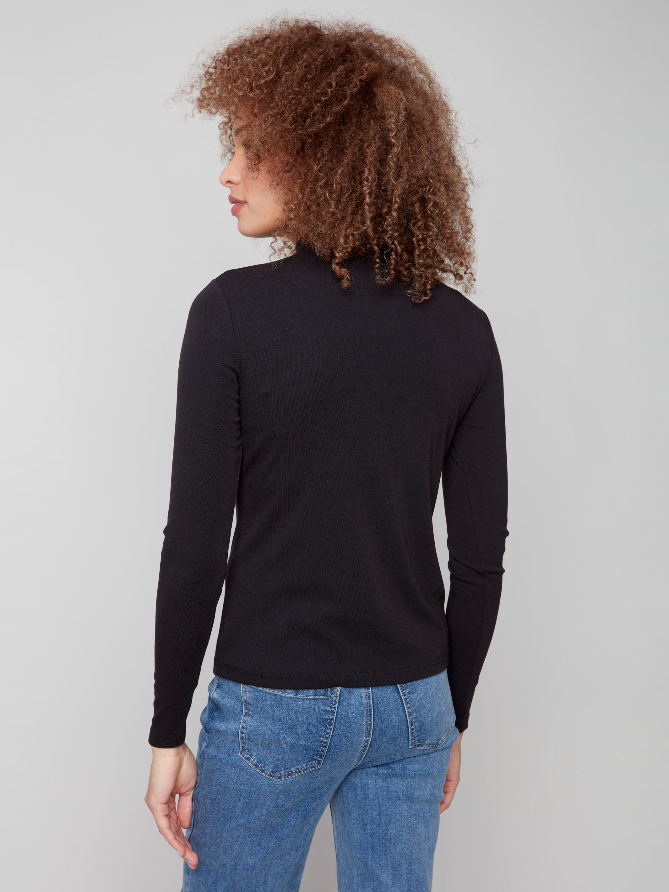 Classic black mock neck top showcasing a sophisticated ribbed texture by Charlie B.