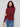 Comfortable long sleeves enhance the sleek look of this cabernet top by Charlie B.
