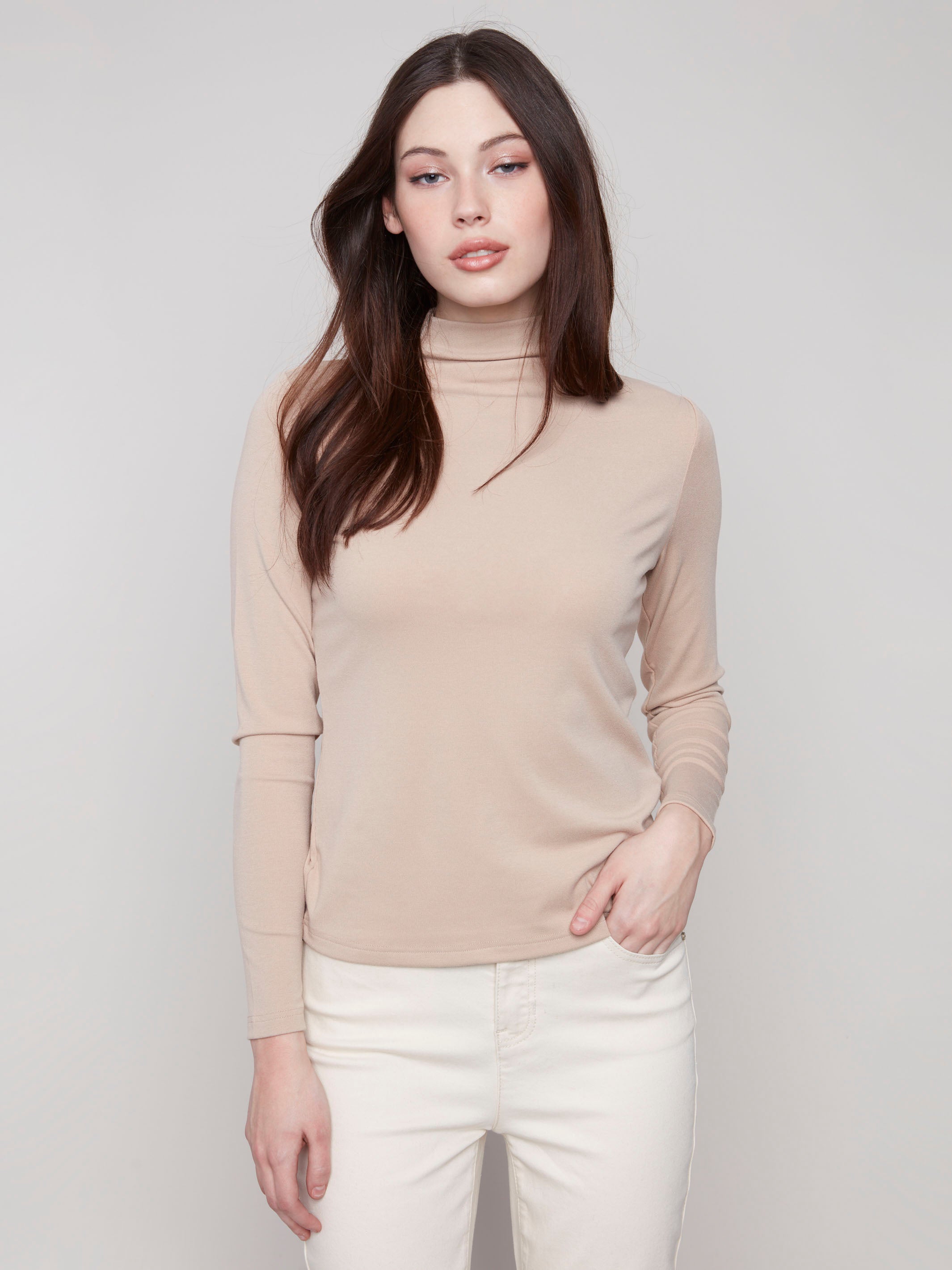 Sesame top featuring a slim fit and long sleeves, perfect for a sleek silhouette by Charlie B.