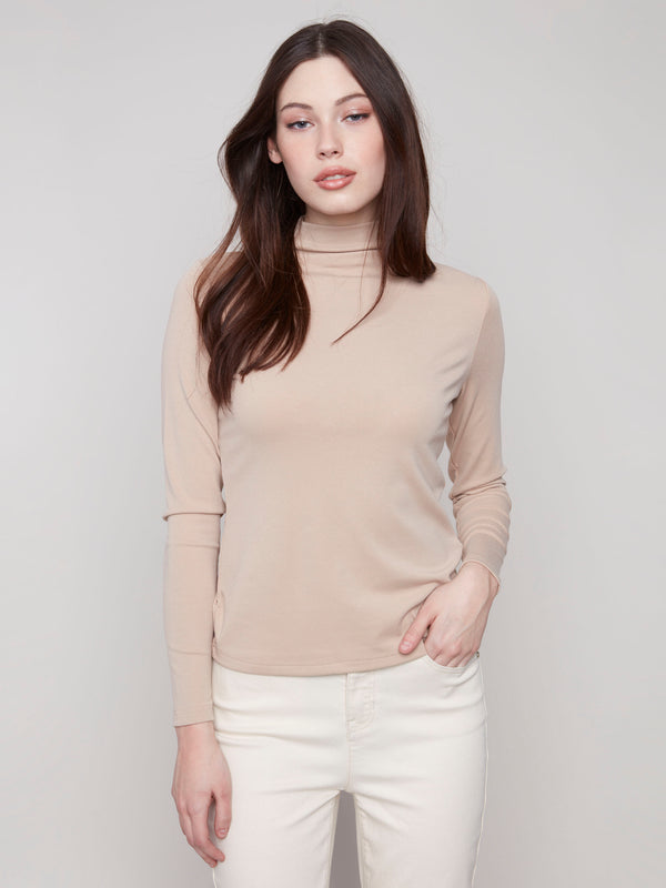 Sesame top featuring a slim fit and long sleeves, perfect for a sleek silhouette by Charlie B.