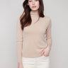 Sesame top featuring a slim fit and long sleeves, perfect for a sleek silhouette by Charlie B.