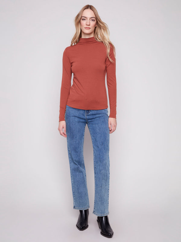 Elegant long-sleeve top with a stylish mock neck, ideal for any season by Charlie B.