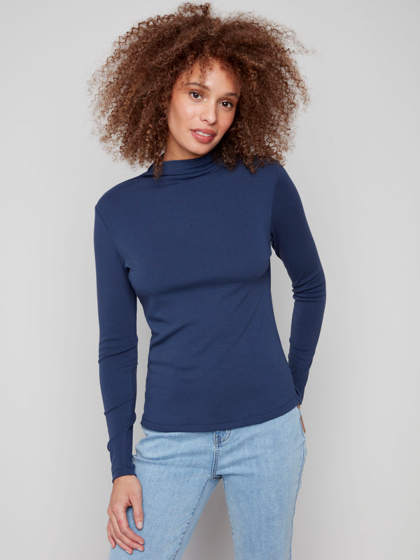 Moonlight blue top featuring a slim fit design and long sleeves, perfect for a sleek silhouette by Charlie B.