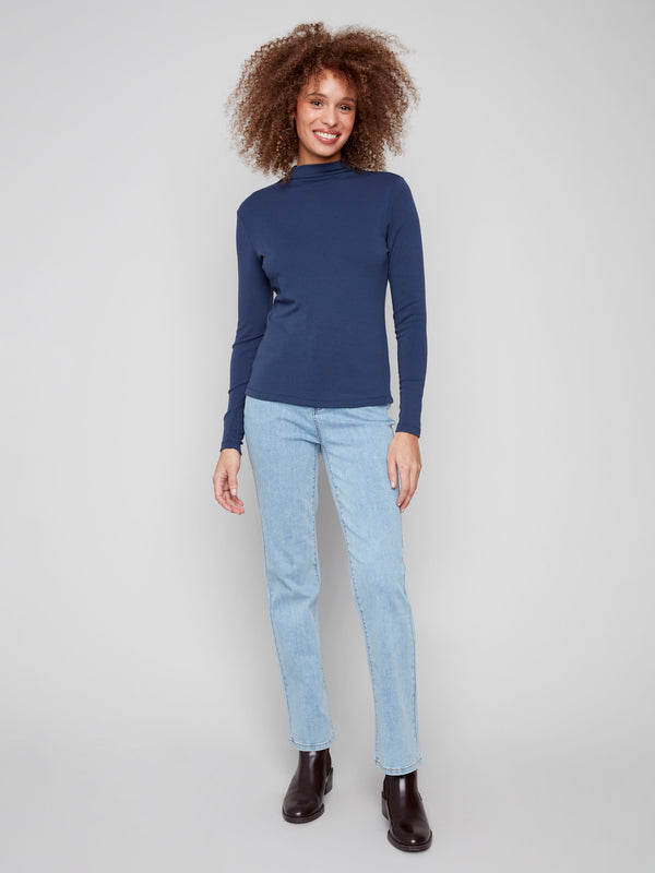 Elegant moonlight blue top with a sophisticated mock neck, ideal for any occasion by Charlie B.