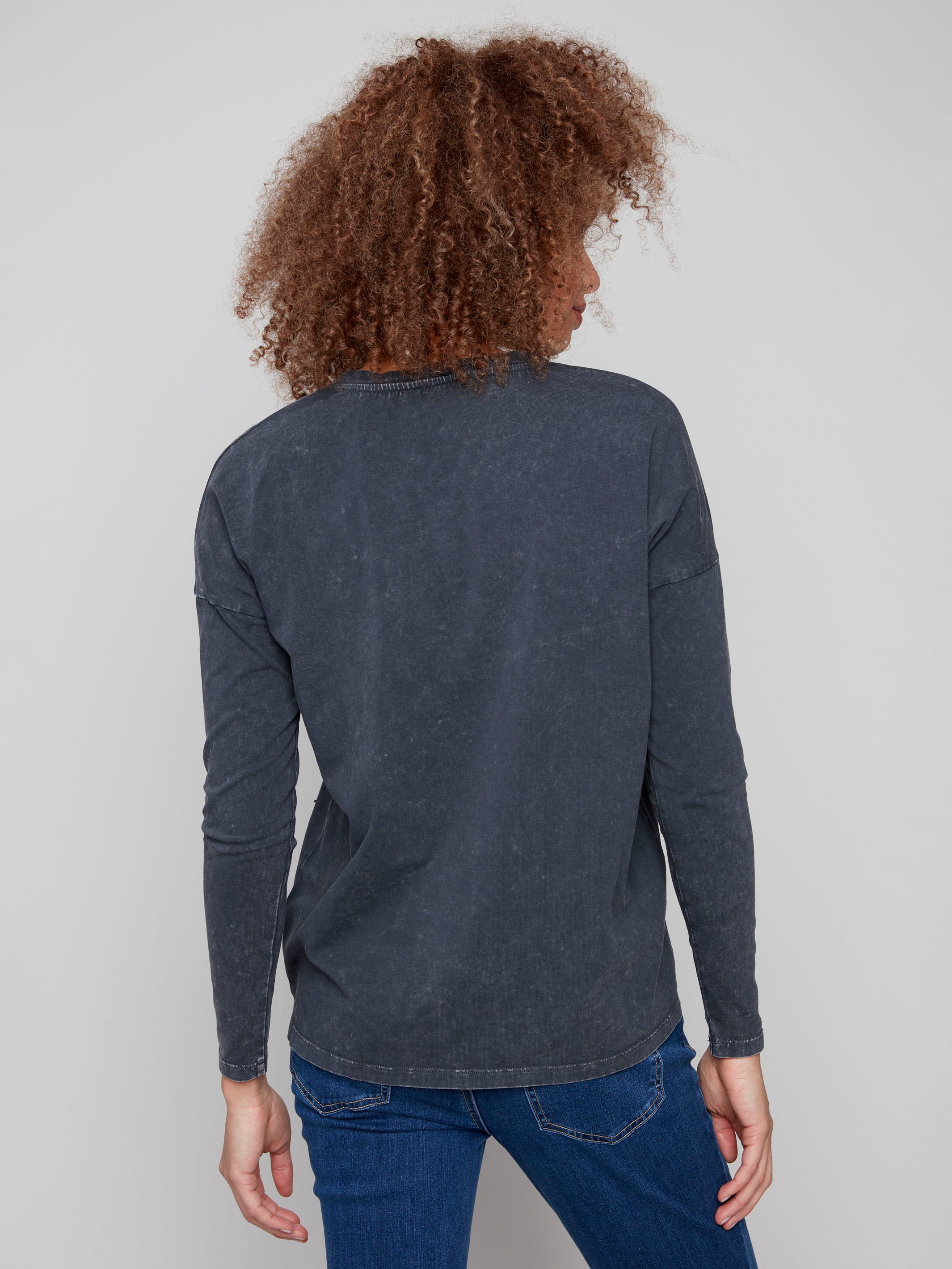 V-neck charcoal top in soft vintage-wash fabric, adorned with charming bead details by Charlie B.