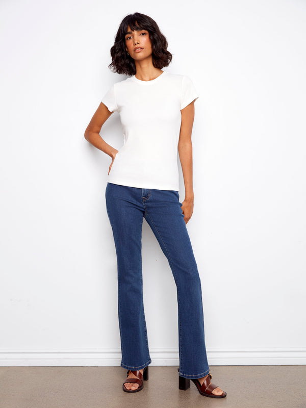 Ribbed texture enhances the white T-shirt's design, offering both comfort and style by Charlie B.