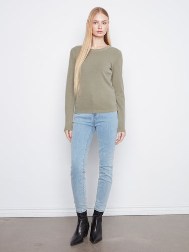 Stylish long-sleeved top in a soft, olive hue with ribbed texture for added comfort. Crafted by Charlie B.