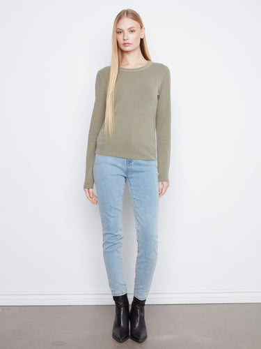 Elegant olive green garment showcasing its flattering slim fit design, ideal for layering or solo wear. By Charlie B.