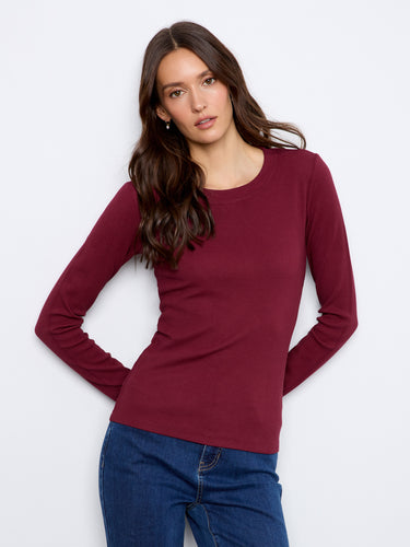 Designed in a flattering slim fit, this essential piece pairs well with jeans or skirts for effortless chic style by Charlie B.