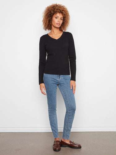 Versatile black ribbed long sleeve top made with high-quality fabric ensuring durability and style, by Charlie B.