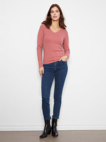 Enjoy the comfort of long sleeves in this elegant piece, designed to keep you cozy and stylish. By Charlie B.