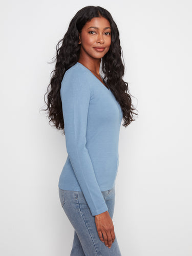 The slim fit of this top accentuates your silhouette beautifully, providing both elegance and ease in every wear by Charlie B.