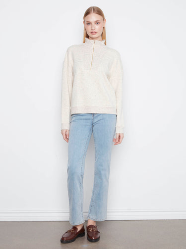 Experience ultimate comfort with long sleeves and a relaxed silhouette in this stylish half-zip mock neck top. By Charlie B.