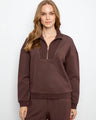 This outfit features a half-zip mock neck, perfect for versatile styling. Crafted in soft scuba fabric by Charlie B.