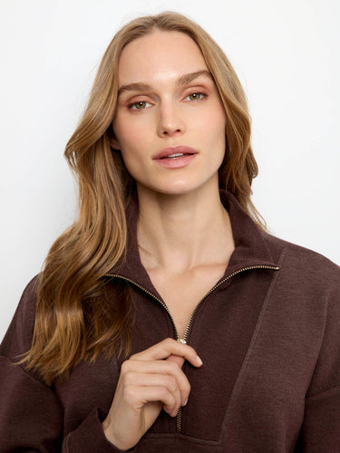 The half-zip mock neck adds functionality and flair to an already elegant design. Crafted with care by Charlie B.