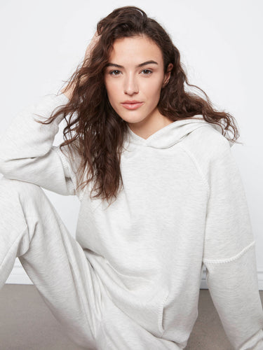 A kangaroo pocket enhances the practicality of this cozy and stylish hoodie, ideal for everyday wear. By Charlie B.