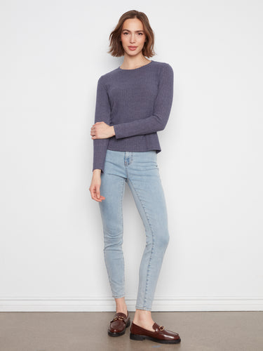 Designed with long sleeves, this piece provides warmth and comfort while maintaining an elegant silhouette by Charlie B.