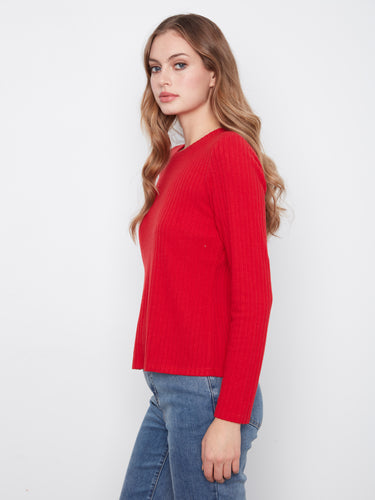Crafted from brushed ribbed fabric, this red top offers a cozy feel while maintaining a chic appearance by Charlie B.