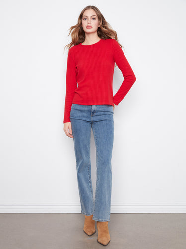 The long sleeves on this vibrant red top provide warmth and style, making it an ideal choice for cooler days by Charlie B.