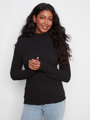 Stylish black bubble knit top featuring a slim fit silhouette, complete with long sleeves by Charlie B.
