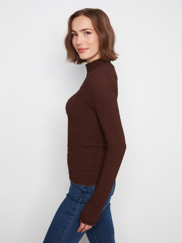 Crafted in a slim fit, this top accentuates your silhouette beautifully and comfortably by Charlie B.