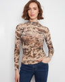 Long sleeve top with a unique print and mock neckline, crafted in stretch mesh fabric for comfort. By Charlie B.