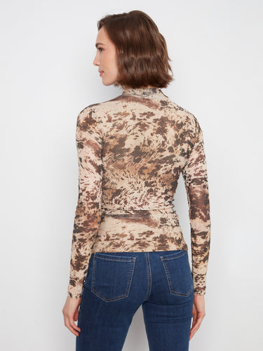 Featuring a mock neckline and long sleeves, this chic top is crafted from comfortable stretch mesh fabric. By Charlie B.