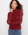 This elegant top features a mock neck design, adding a touch of sophistication to any outfit by Charlie B.