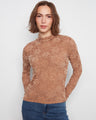 The mock neck top showcases a beautiful flocked lace design, creating an elegant and sophisticated look. By Charlie B.