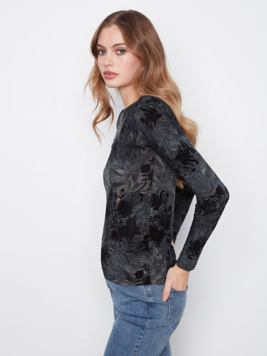 Long sleeve top in midnight floral pattern, showcasing a flattering boat neckline, by Charlie B.