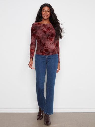 Chic long-sleeved top featuring side ruching that adds texture and style to your outfit. Ideal for layering or wearing alone. By Charlie B.