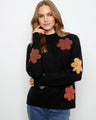 This sweater features a classic crew neckline, offering a timeless and versatile look for any wardrobe. By Charlie B.